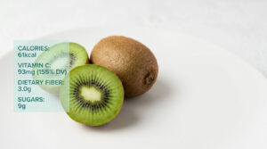 A sliced kiwi fruit reveals vibrant green flesh and black seeds, placed next to a whole kiwi on a white plate.